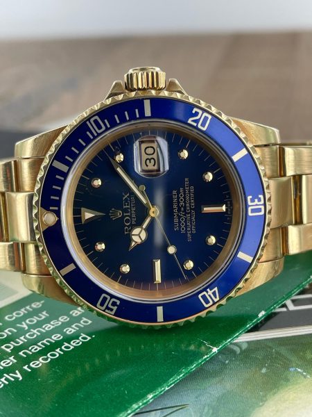 1981 18K Rolex Submariner ref 16808, original papers, blue “nipple” dial